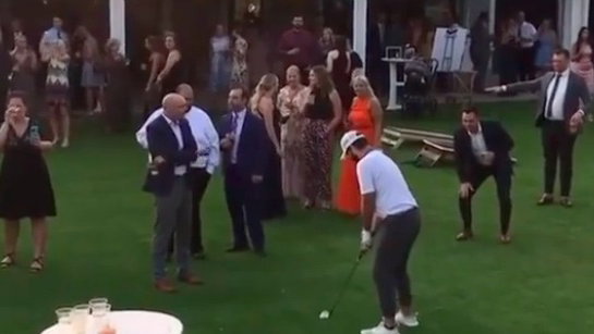 WATCH: Golfer plays his shot in front of wedding party!